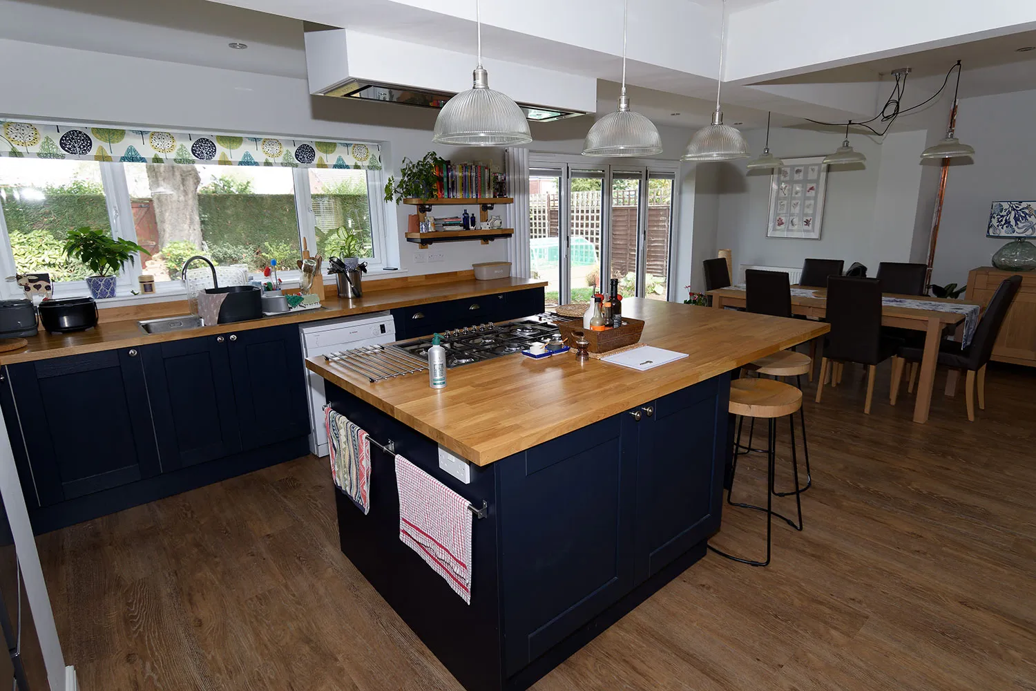 a kitchen with a center island and a stove top oven