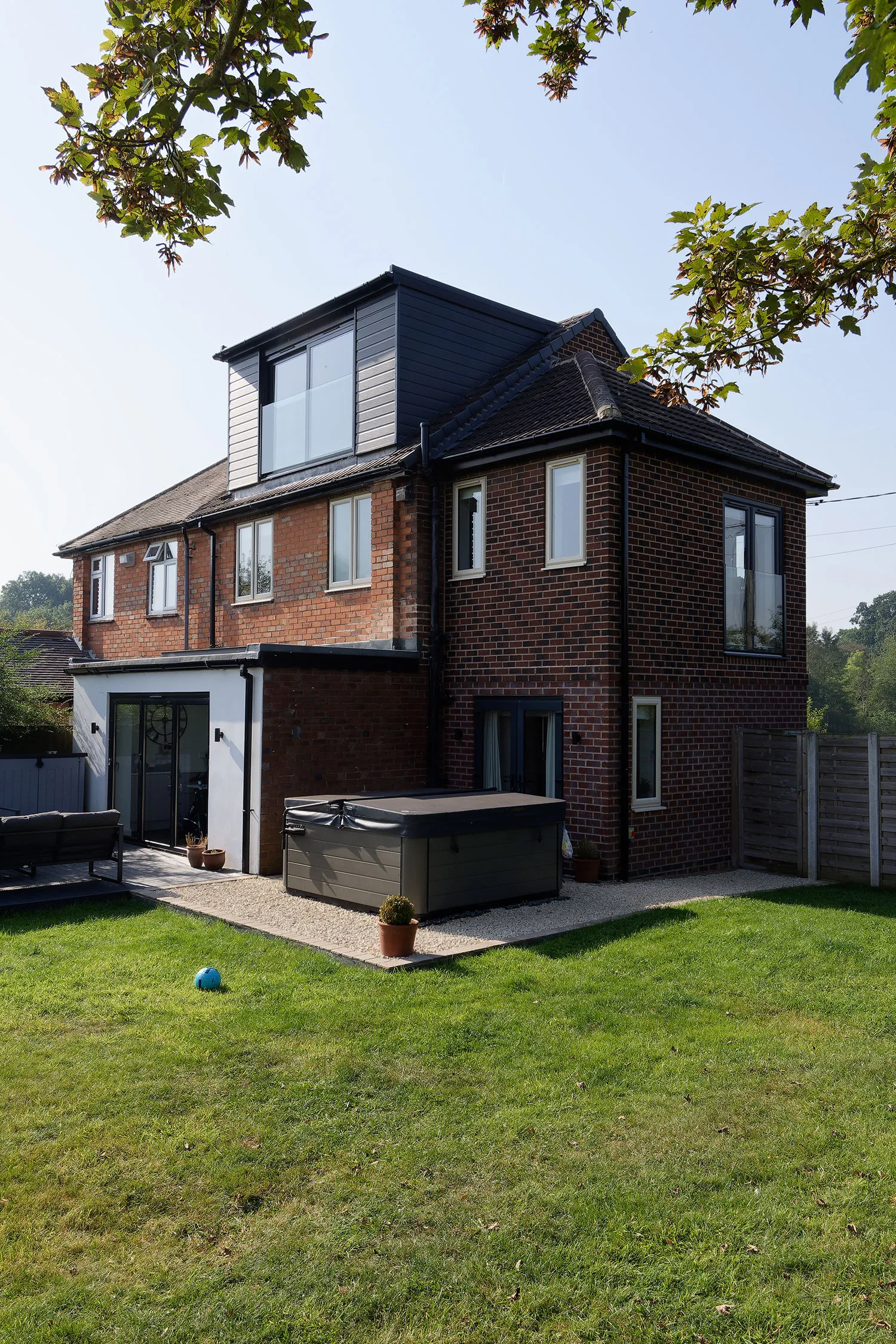 a large house with a hot tub in front of it